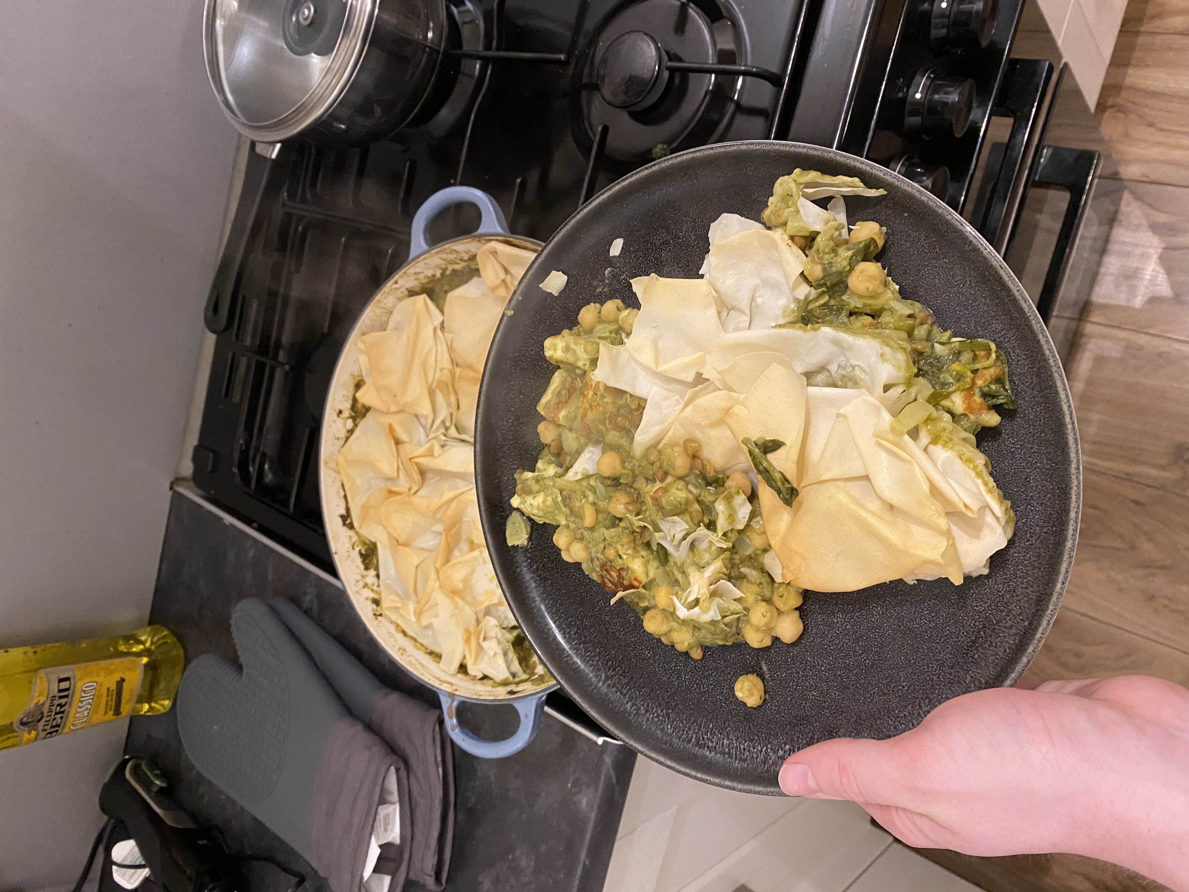 A picture of creamy halloumi, spinach and chickpea pie with a filo lid